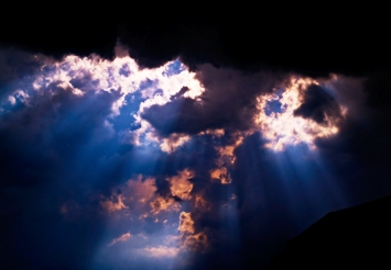 This dramatic photo of the sun trying to peak through thunderstorm clouds would make for interesting weather analysis.  It was taken by photographer/graphic designer Michel Mayerle of Rothrist, Switzerland.